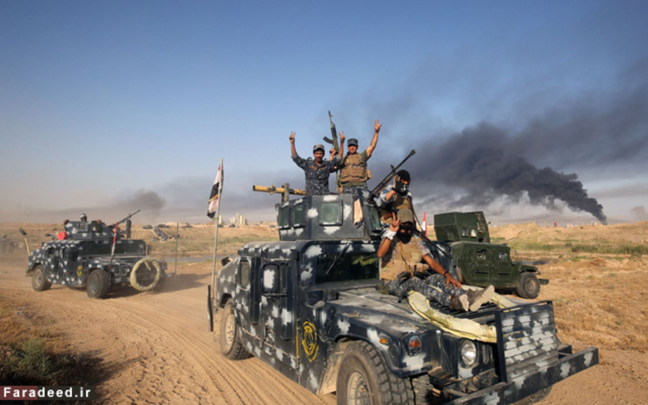 نیروهای طرفدار دولت عراق در راه فلوجه برای مقابله با داعش